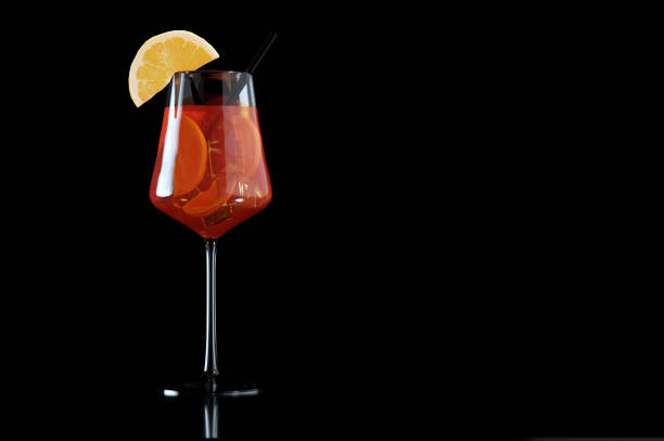 istock Glass of Spritz cocktail isolated on black background 1448485614