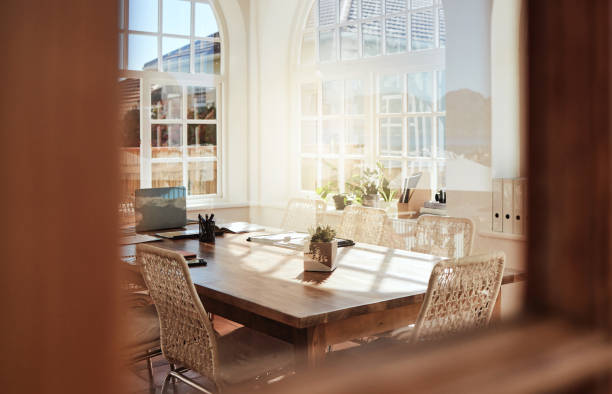 istock Interior, room and design with an empty home office in an office of a modern workplace during the day. Building, architecture and table in a corporate company for meeting or strategy after hours 1448487174
