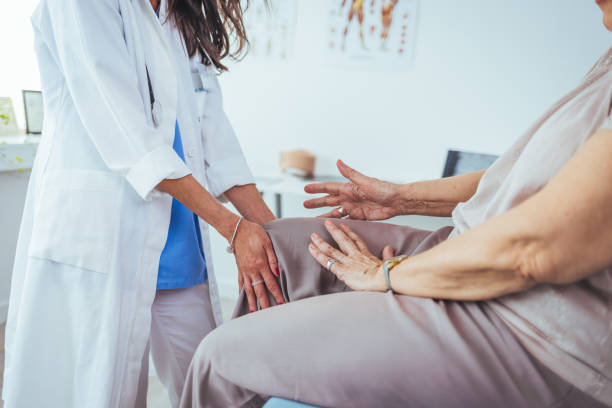 istock Physical Doctor consulting with patient Knee problems 1448487679