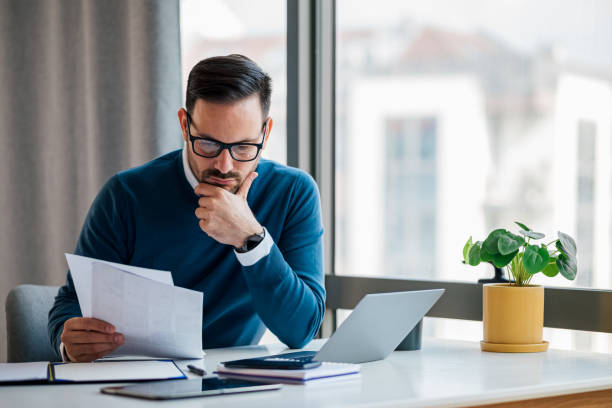 istock Serious young adult business executive, brainstorming at work. 1448488604