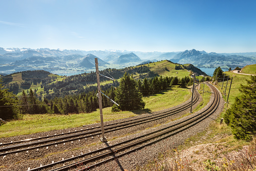 Straight double railway line through an idyllic landscape