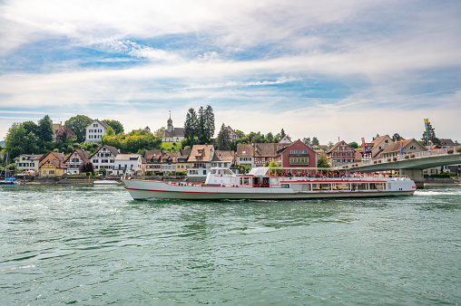 Ferry sailing on the river Rhine in Stein am Rhein, Switzerland during a beautiful summer day. The ferry sails over the river Rhine and the Untersse between Schaffhausen and Constance on the shore of the Bodensee