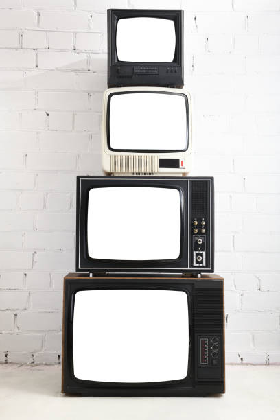istock Four vintage white screen televisions with a white brick background. 1448489178