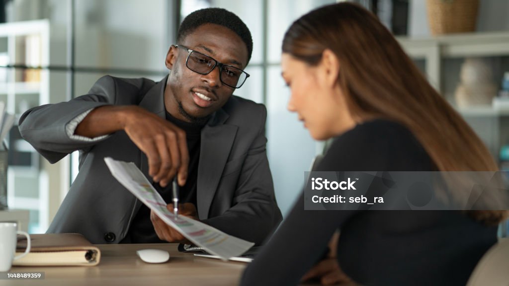 Financial advisor talking to customer Financial Advisor Stock Photo