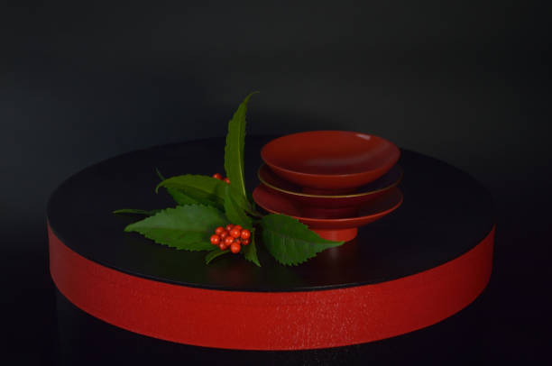 image for a new year day with sake cups on the black background/Studio Shot