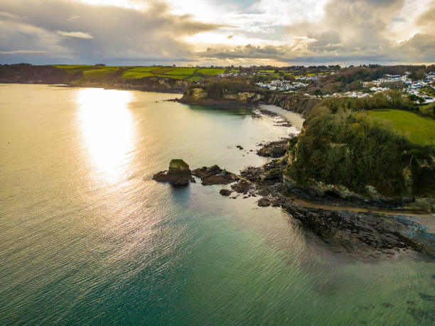 istock Low sun at a Rocky headland at Charlestown in Cornwall 1448491674