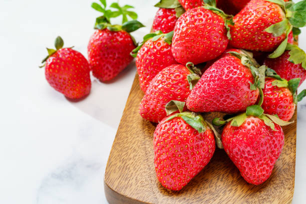 istock Fresh strawberry fruits on marble background 1448496447