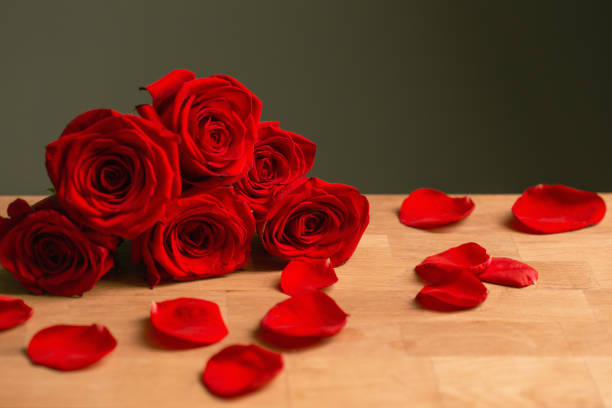 bouquet of red roses on green background