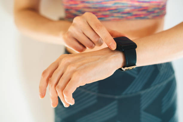 istock Woman tracks pulse on a smart watch 1448499932