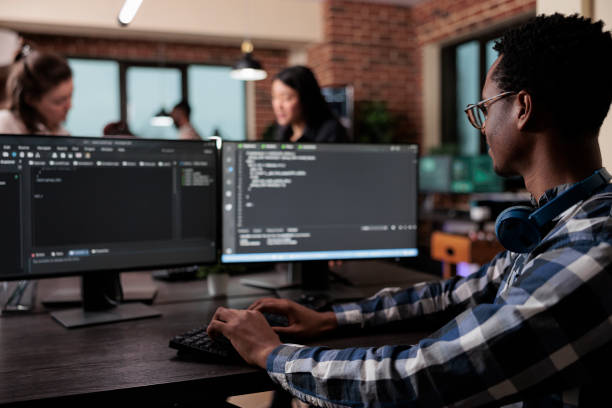 istock Blockchain developer reflecting at low levels of security and how to improve mainframe defence system. 1448500331