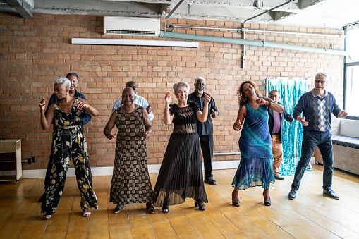 Senior friends dancing on a dance hall