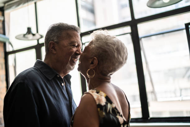 istock Senior couple looking at each other at apartment 1448500654
