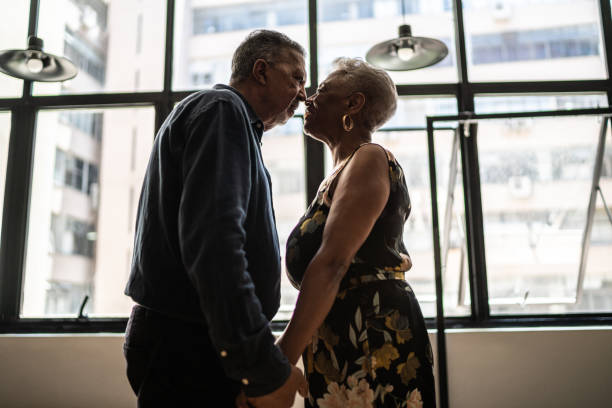 istock Senior couple looking at each other at apartment 1448500655