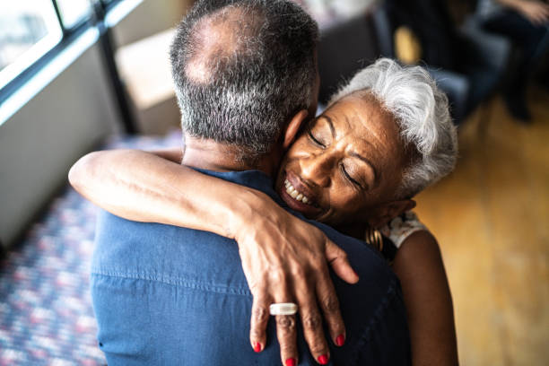 istock Senior couple embracing at home 1448500657
