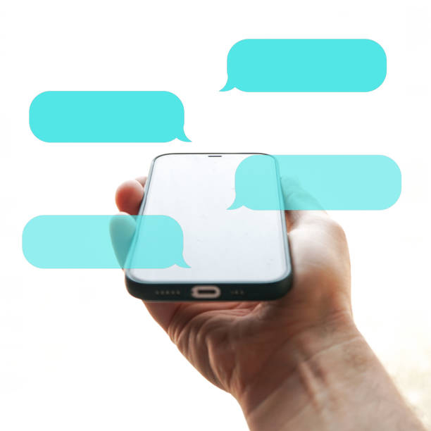 istock hand holding a smartphone with chat symbol, texting on the phone, phone addiction 1448500672