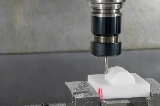 istock The  CNC milling machine cutting the nylon 6 material part with ball end mill tool. 1448502090