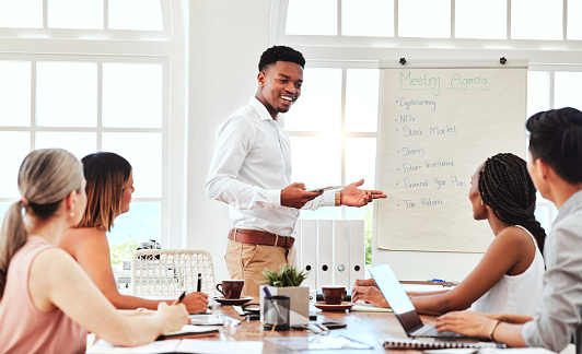 Business meeting, corporate management presentation and black man leader coaching team in modern office. Boardroom discussion, company mentor training and research or planning innovation seminar