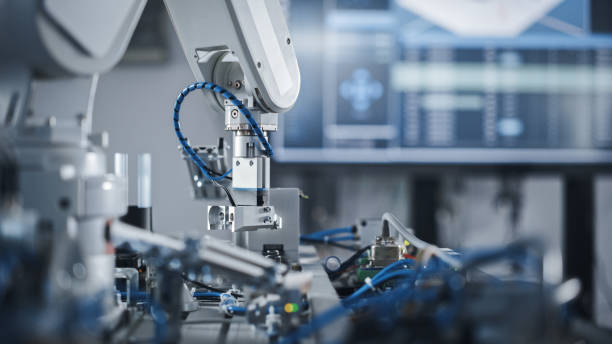 Robotics Industry Four Engineering Facility Robot Arm Moving at Different Directions. High Tech Industrial Technology Using Modern Machine Learning. Mass Production Automatics. Close Up stock photo