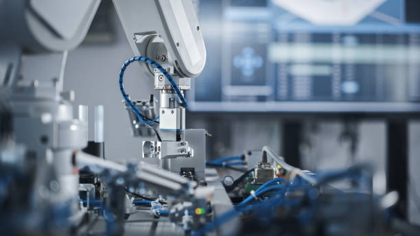 Robotics Industry Four Engineering Facility Robot Arm Moving at Different Directions. High Tech Industrial Technology Using Modern Machine Learning. Mass Production Automatics. Close Up Robotics Industry Four Engineering Facility Robot Arm Moving at Different Directions. High Tech Industrial Technology Using Modern Machine Learning. Mass Production Automatics. Close Up factory stock pictures, royalty-free photos & images