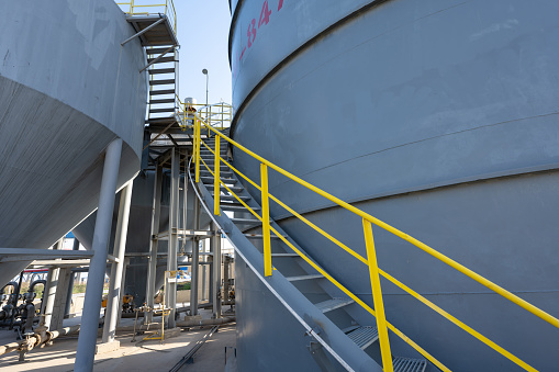 Metal stairs on a fuel storage tank at a chemical plant