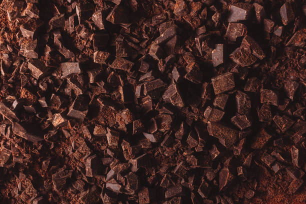 istock Flat lay view of dark chocolate chopped. 1448504440
