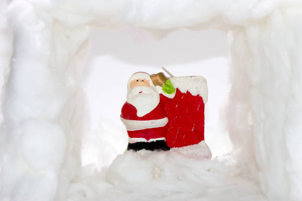 Santa Claus surrounded by snow, creative holiday design, minimal concept