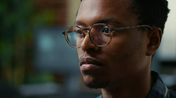 istock Focus on moving eyes of software developer writing code in front of monitor working focused 1448504888