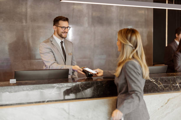 istock Hotel Receptionist taking Contactless Payment 1448505924