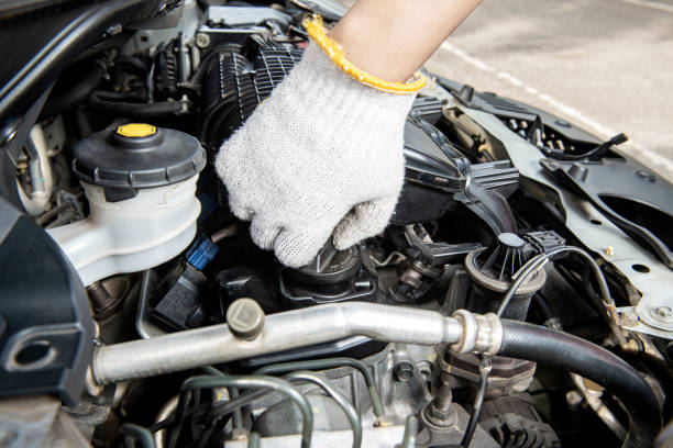 istock Car mechanic working on engine repair 1448506073