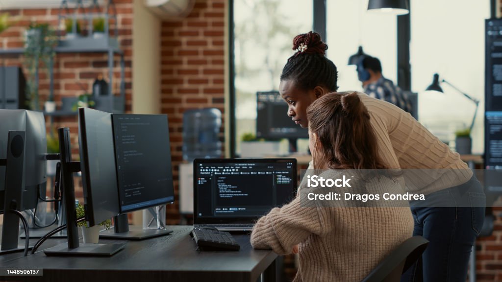 Computer Engineering Code Two System Engineers Analyzing Source Code On Laptop Looking For Errors ...
