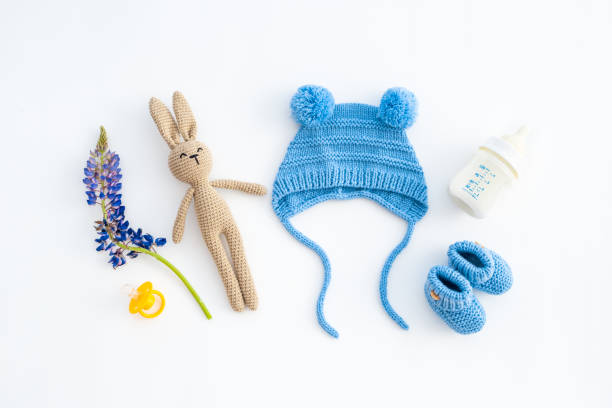 istock Baby boy blue hat with booties and accessories, top view 1448506669