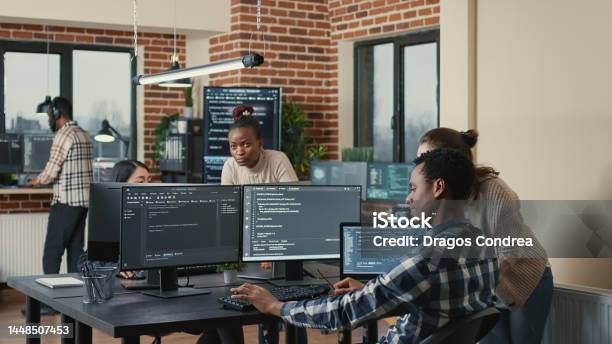 Programmer Analyzing Compiling Code On Multiple Screens Takes Off ...