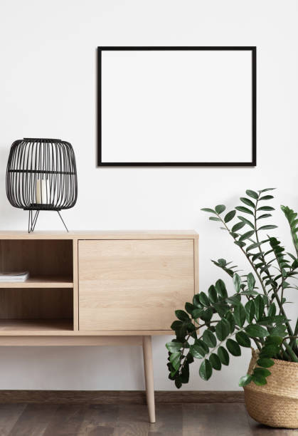 istock Artwork mockup in interior design. Blank picture frame on a wall. Horizontal orientation 1448509603