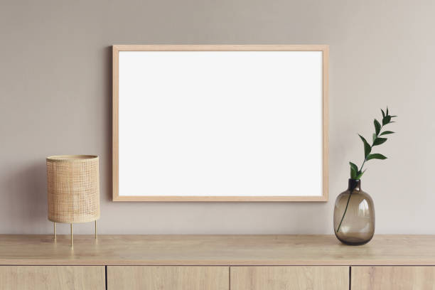 istock Artwork mockup in interior design. Blank picture frame on a wall. Horizontal orientation 1448509639