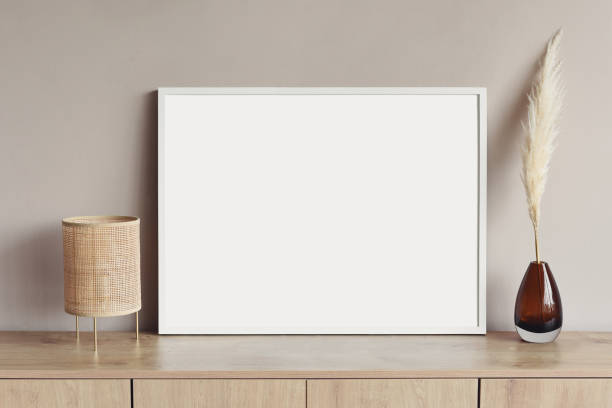 istock Artwork mockup in interior design. Blank picture frame on a wall. Horizontal orientation 1448509687