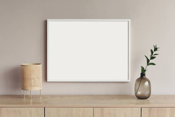 istock Artwork mockup in interior design. Blank picture frame on a wall, horizontal landscape orientation 1448510913