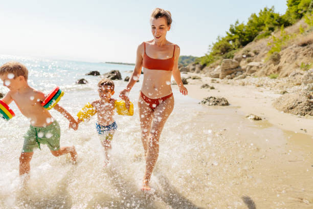 istock With mommy at the wild beach 1448511969