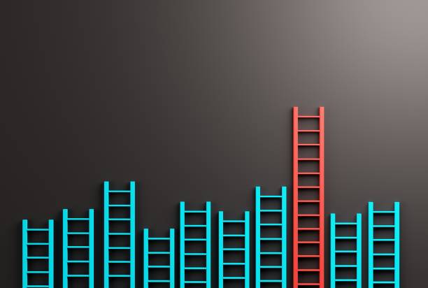istock Ladders against the wall and one of a different color reaching higher. 1448512178