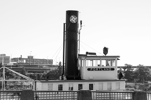 Portland, Oregon, USA- October 1, 2022: Black and white Oregon Maritime Museum in a historic Sternwheeler ship boat at downtown Portland