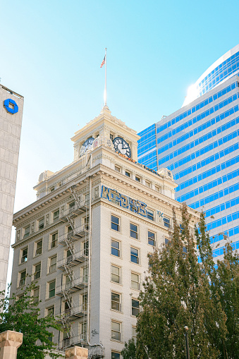 Portland, Oregon, USA- October 1, 2022: Jackson Tower, formerly The Oregon Journal Building vandalized with blue and gold on the top floor of the tower