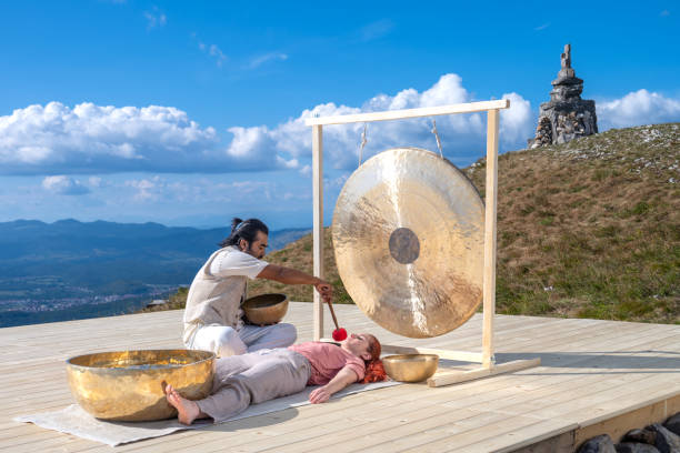 istock Man playing rin gong for sound therapy 1448513713