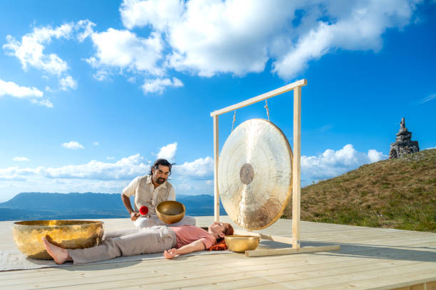 istock Man playing rin gong for sound therapy 1448513720