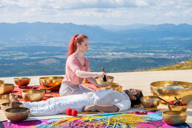 istock Woman playing rin gong for therapy 1448513724