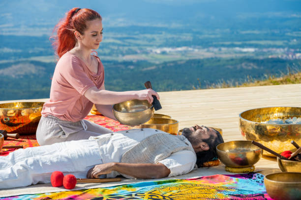 istock Woman playing rin gong for therapy 1448513728
