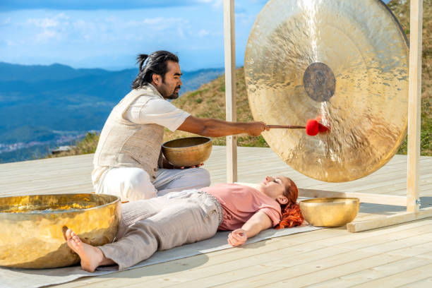 istock Man playing gong for sound therapy 1448513746