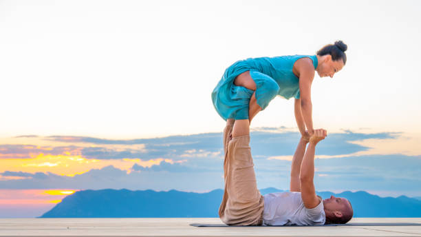 istock Couple doing yoga on deck 1448513799