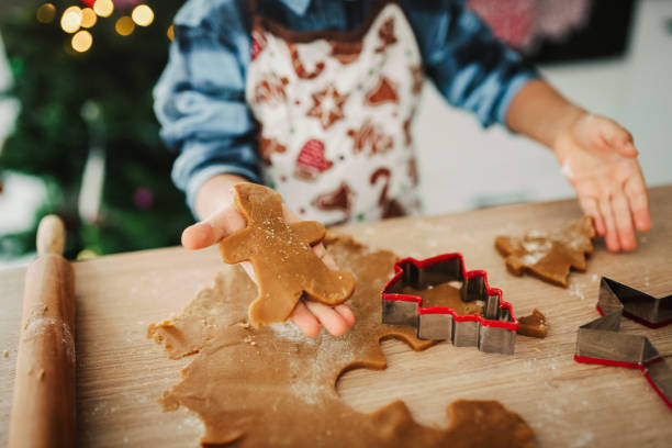 istock Child making Christmas cookies. 1448515114