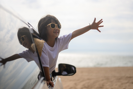 Hand out car window. Happy travel at beach. Family in car happy together enjoy with traveling. gesture happy travel images