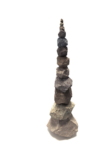 Straight pillar of 12 balanced rocks. Very high, almost impossible arrangement of various colored stones suitable for designs and illustrations with copy space.