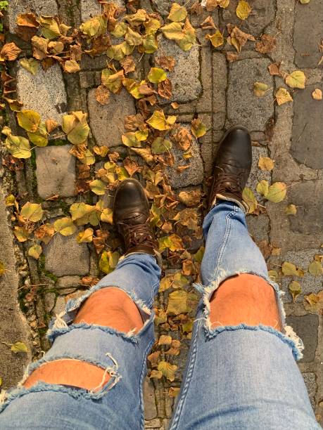 Ripped jeans in Autumn. stock photo